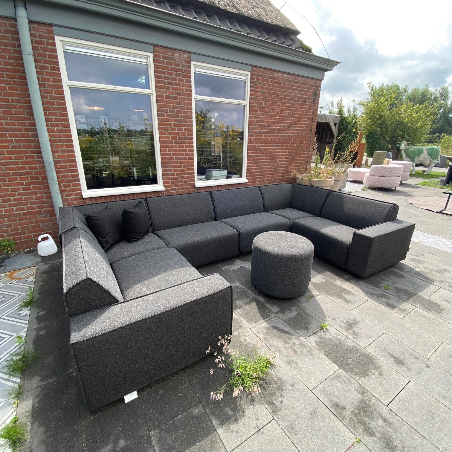 SALE |  Icon u-zits in Deluxe antraciet + poef 60 cm rond